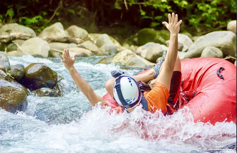 Floating the La Fortuna river through rainforest.