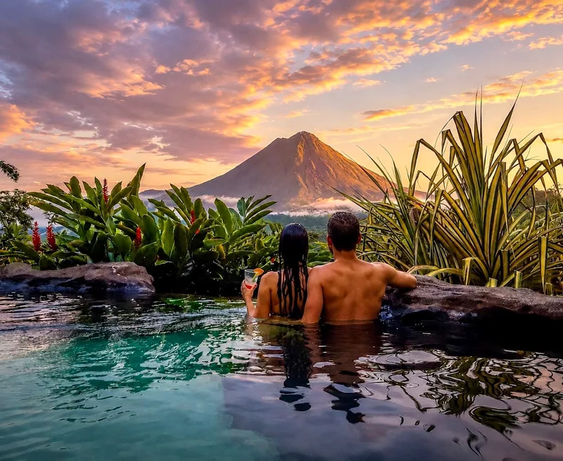 The Springs Resort: infinity pools set high on the slope, looking straight at Arenal.