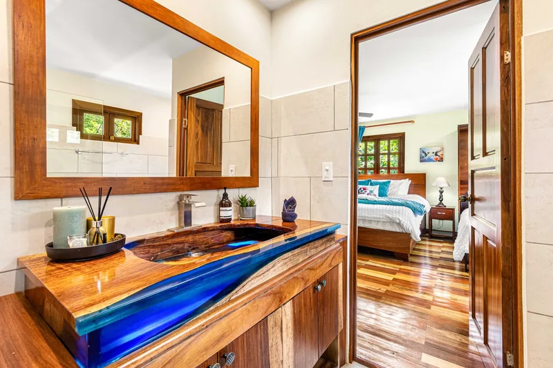 The Hummingbird Room's bathroom, with the bedroom through the door.