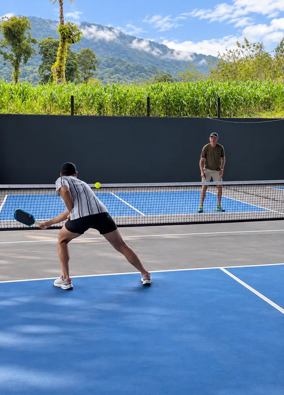 Doubles rally on a covered court near Arenal Volcano, La Fortuna