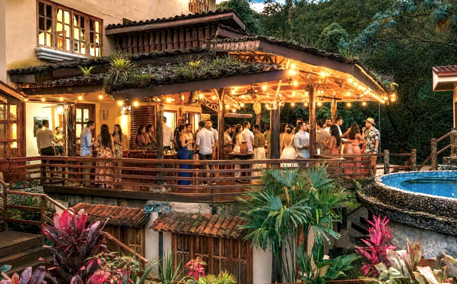 Wedding reception on the lodge deck and pool terrace surrounded by rainforest at The Majestic Lodge, La Fortuna